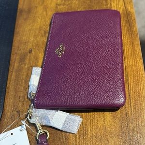 New purple Coach wristlet